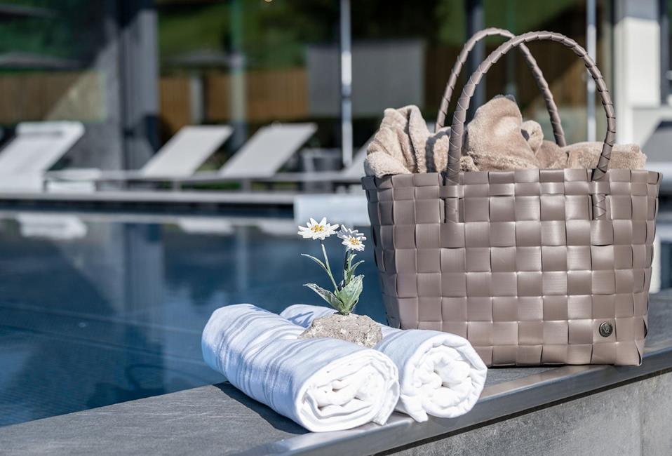 A wellness bag at the edge of the outdoor pool